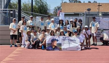 group photo of young adults on track